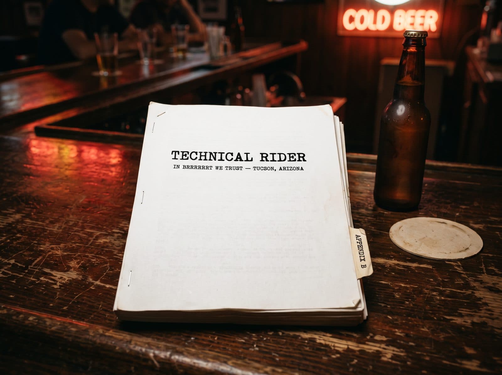 The fourteen-page technical rider on a bar table